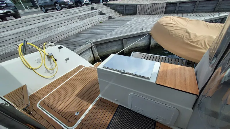 Super Trouper Yacht Photos Pics 2019 Fountaine Pajot Saona 47 yacht deck with teak flooring and dockside view.