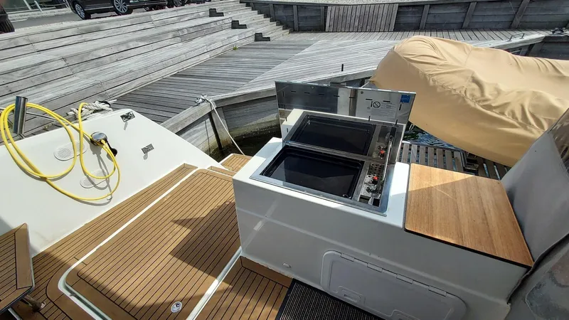 Super Trouper Yacht Photos Pics Outdoor kitchen on 2019 Fountaine Pajot Saona 47 yacht with wooden deck.