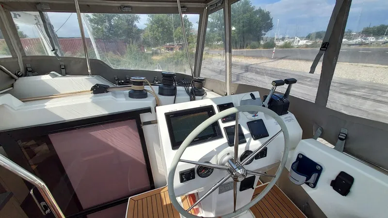 Super Trouper Yacht Photos Pics Helm of 2019 Fountaine Pajot Saona 47 catamaran with modern navigation equipment.