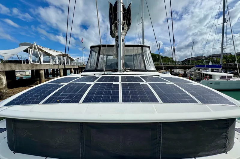 Promprang Yacht Photos Pics 2020 Lagoon 50 catamaran with solar panels on deck, docked at marina.