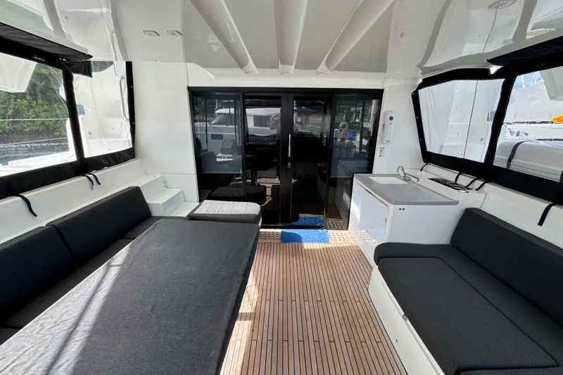 Promprang Yacht Photos Pics Spacious interior of 2020 Lagoon 50 catamaran with modern seating and sleek design.
