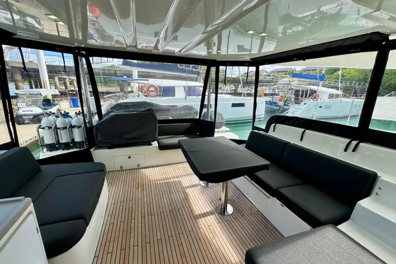 Promprang Yacht Photos Pics Spacious interior of 2020 Lagoon 50 catamaran with modern seating and table.