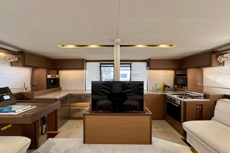 Promprang Yacht Photos Pics Luxurious interior of 2020 Lagoon 50 yacht with modern kitchen and entertainment area.