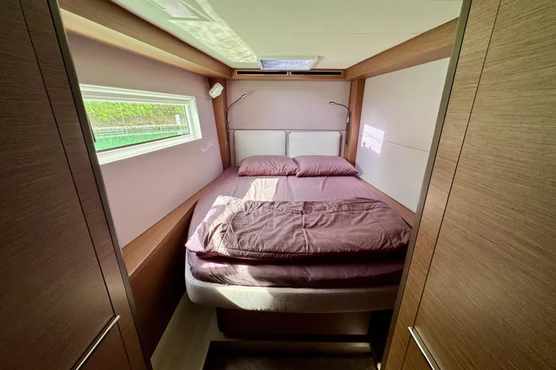 Promprang Yacht Photos Pics Cozy bedroom interior of 2020 Lagoon 50 yacht with natural light and modern design.