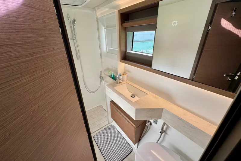 Promprang Yacht Photos Pics Modern bathroom interior on 2020 Lagoon 50 yacht, featuring sleek design and amenities.