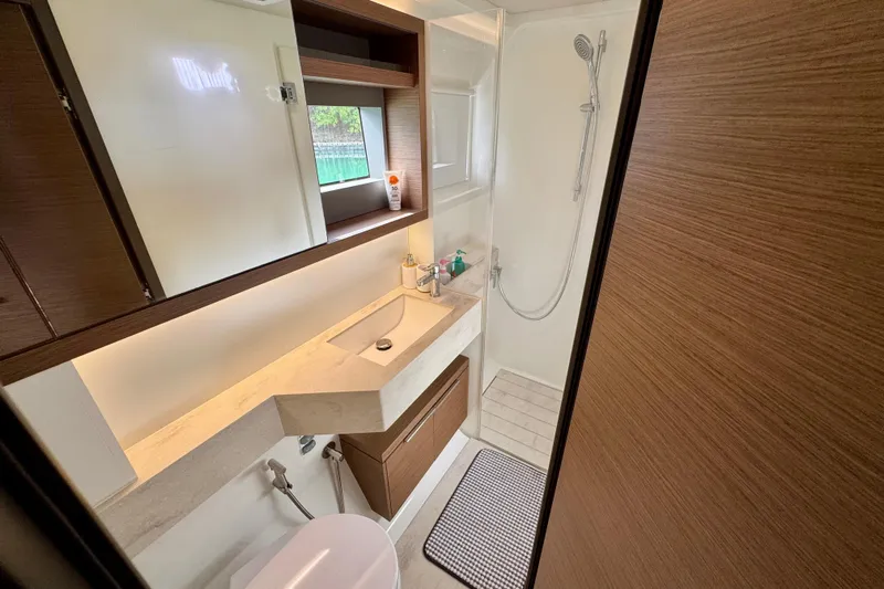 Promprang Yacht Photos Pics Modern bathroom interior of 2020 Lagoon 50 yacht, featuring sleek design and amenities.