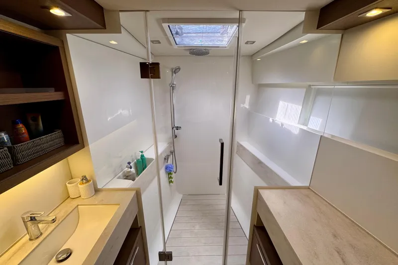 Promprang Yacht Photos Pics Modern bathroom interior of 2020 Lagoon 50 yacht with shower and sink.