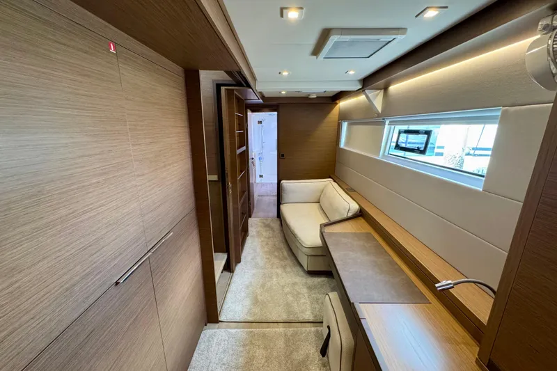 Promprang Yacht Photos Pics Luxurious interior of 2020 Lagoon 50 yacht with modern wood finishes and cozy seating area.