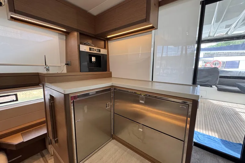 Promprang Yacht Photos Pics Modern kitchen interior of 2020 Lagoon 50 yacht with stainless steel appliances.