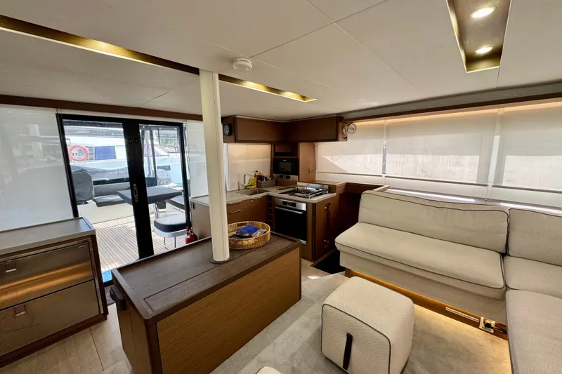 Promprang Yacht Photos Pics Luxurious interior of 2020 Lagoon 50 yacht with modern kitchen and seating area.