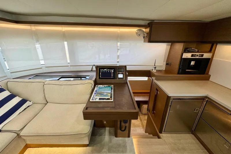 Promprang Yacht Photos Pics Luxurious interior of 2020 Lagoon 50 yacht with modern kitchen and cozy seating area.