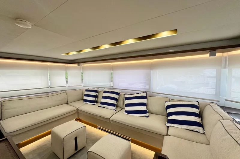 Promprang Yacht Photos Pics Luxurious interior of 2020 Lagoon 50 yacht with plush seating and striped cushions.