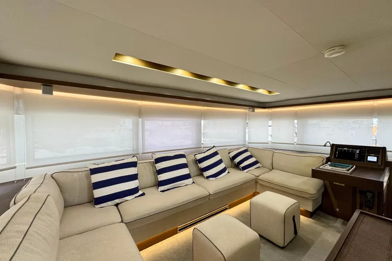 Promprang Yacht Photos Pics Luxurious interior of 2020 Lagoon 50 yacht with striped cushions and modern decor.