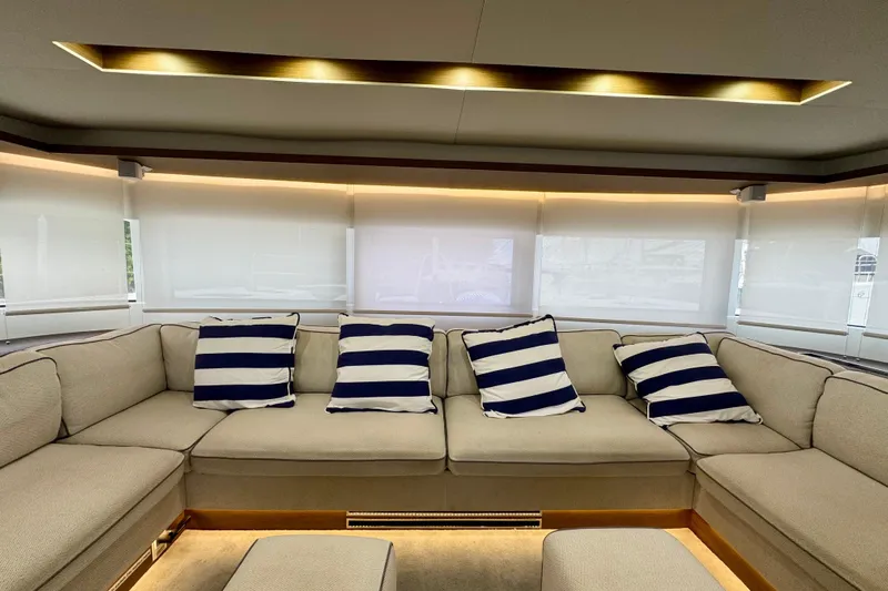Promprang Yacht Photos Pics Luxurious interior of 2020 Lagoon 50 yacht with striped cushions and elegant lighting.