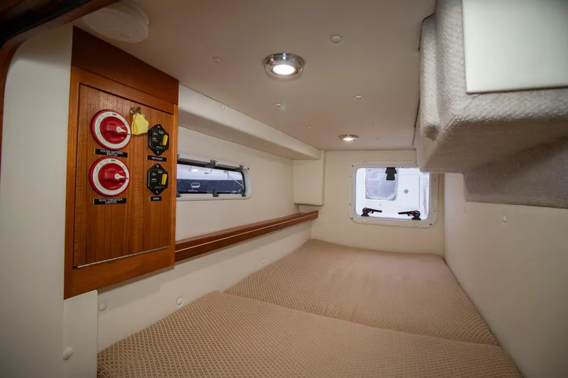  Yacht Photos Pics 2021 Aspen C108 boat interior cabin with control panel and cozy sleeping area.