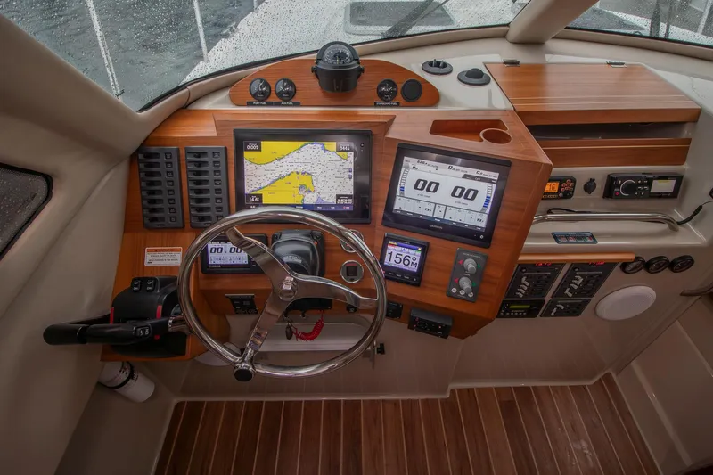  Yacht Photos Pics Cockpit of 2021 Aspen C108 boat with navigation screens and controls.