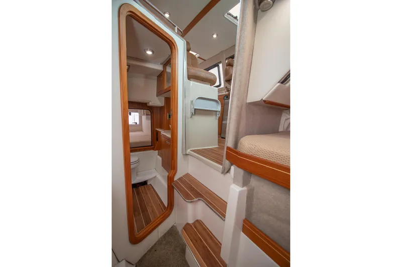  Yacht Photos Pics Interior of 2021 Aspen C108 boat with wooden accents and compact design.