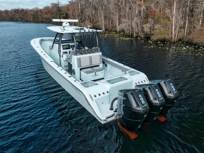 One Time Yacht Photos Pics 2024 Front Runner 36 Center Console boat with triple 400 engines on a serene lake.