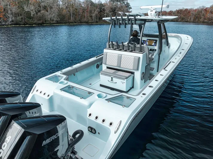 One Time Yacht Photos Pics 2024 Front Runner 36 Center Console boat on a serene lake.