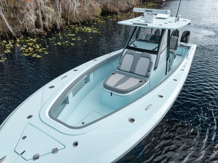 One Time Yacht Photos Pics 2024 Front Runner 36 Center Console boat on a serene waterway.