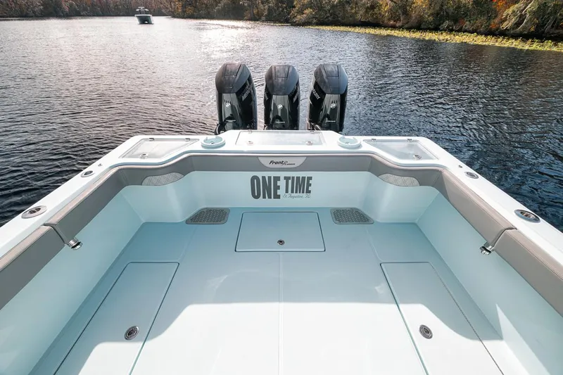 One Time Yacht Photos Pics 2024 Front Runner 36 Center Console boat on a serene lake.