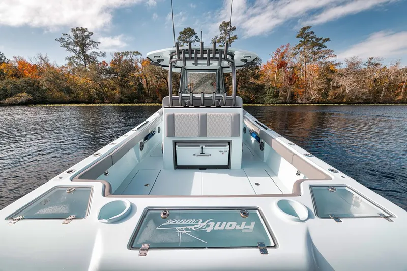One Time Yacht Photos Pics 2024 Front Runner 36 Center Console boat on a serene lake with autumn trees.