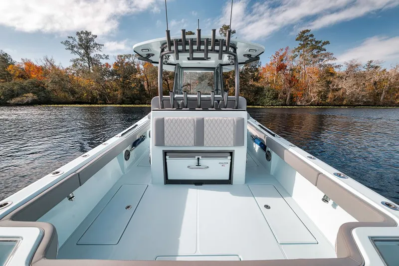 One Time Yacht Photos Pics 2024 Front Runner 36 Center Console boat on a serene lake with autumn trees.