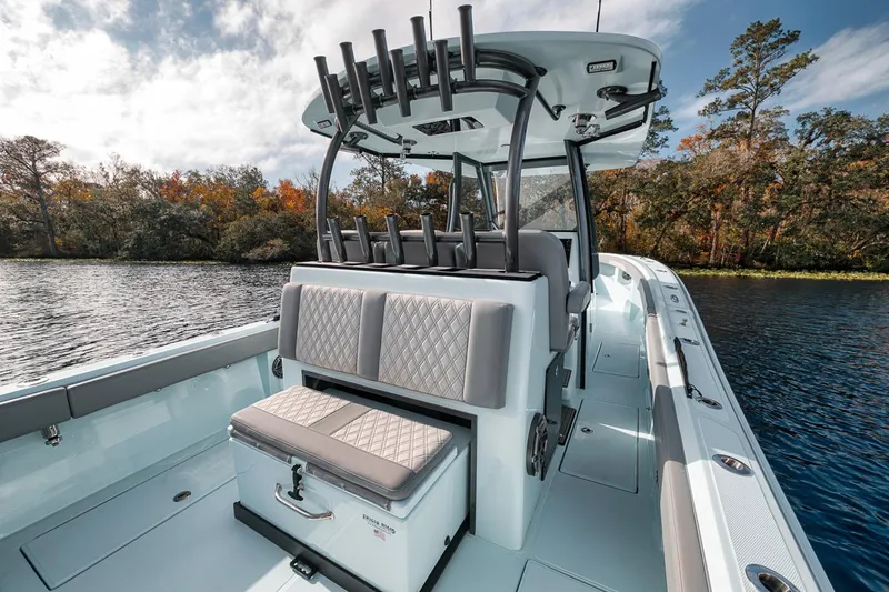 One Time Yacht Photos Pics 2024 Front Runner 36 Center Console boat on a serene lake.