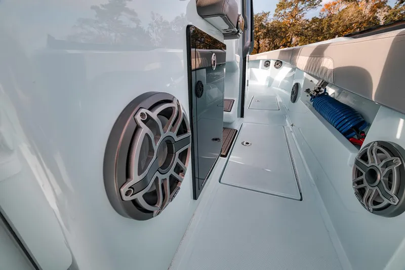 One Time Yacht Photos Pics 2024 Front Runner 36 Center Console boat interior with speakers and storage compartments.