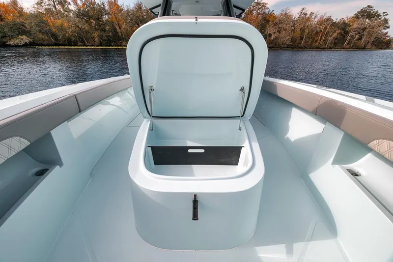 One Time Yacht Photos Pics 2024 Front Runner 36 Center Console boat with open storage compartment on deck.