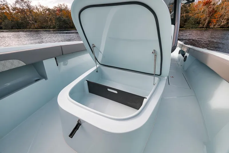 One Time Yacht Photos Pics 2024 Front Runner 36 Center Console boat with open storage compartment on deck.