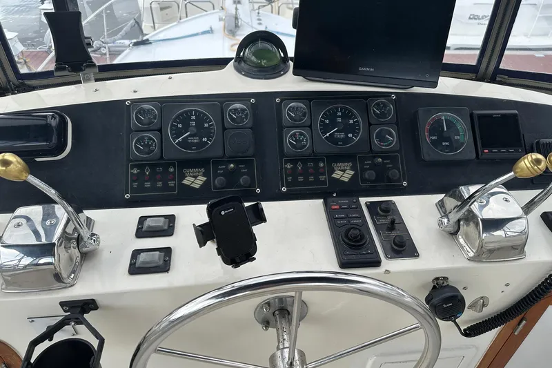 Off Ramp Yacht Photos Pics Control panel of a 2002 Novatec Sundeck boat with gauges and navigation equipment.