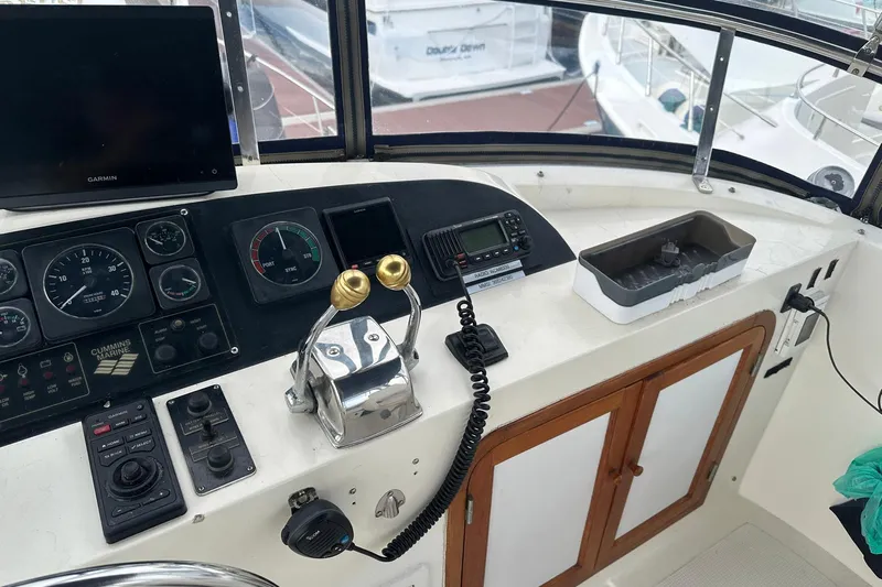 Off Ramp Yacht Photos Pics Control panel of a 2002 Novatec Sundeck boat with navigation equipment and gauges.