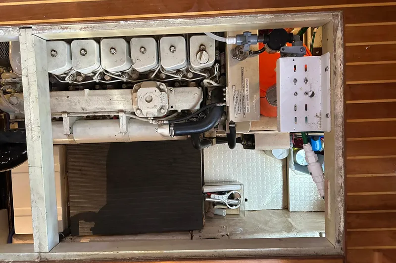 Off Ramp Yacht Photos Pics Engine compartment of a 2002 Novatec Sundeck boat, showcasing mechanical components.