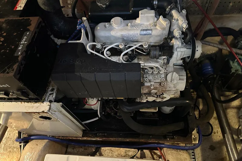 Off Ramp Yacht Photos Pics Engine compartment of a 2002 Novatec Sundeck boat, showcasing mechanical components.