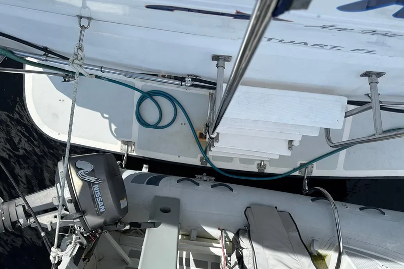 Off Ramp Yacht Photos Pics 2002 Novatec Sundeck yacht with outboard motor and deck equipment, viewed from above.