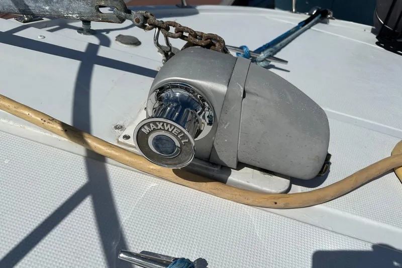 Off Ramp Yacht Photos Pics Maxwell windlass on 2002 Novatec Sundeck boat deck, with anchor chain and rope.