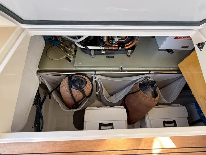 Wild Rose Yacht Photos Pics Engine compartment of 2015 MJM 36z Downeast boat with storage and equipment.