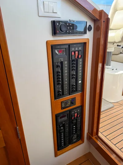 Wild Rose Yacht Photos Pics Electrical panel on 2015 MJM 36z Downeast boat with wooden trim.