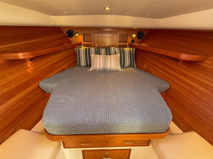 Wild Rose Yacht Photos Pics Luxurious cabin interior of 2015 MJM 36z Downeast with cozy bedding and wooden finish.