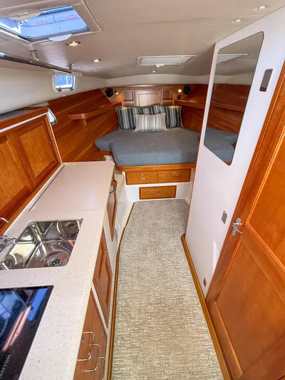 Wild Rose Yacht Photos Pics 2015 MJM 36z Downeast yacht interior with kitchen and cozy sleeping area.
