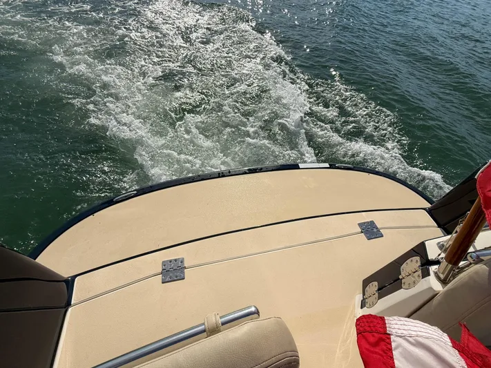 Wild Rose Yacht Photos Pics 2015 MJM 36z Downeast boat stern view on water.