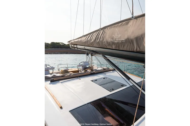  Yacht Photos Pics Dufour 520 Grand Large 2018 yacht deck with sail cover, ocean view.