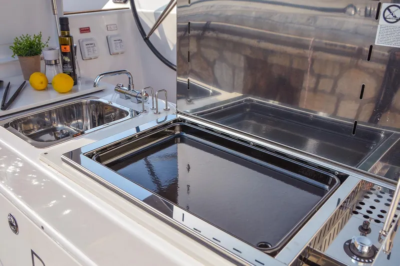  Yacht Photos Pics Outdoor kitchen on 2018 Dufour 520 Grand Large yacht with sink and grill.