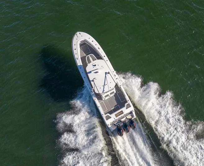 Catch 22 Yacht Photos Pics 2021 Front Runner 36 Center Console boat cruising on open water, aerial view.