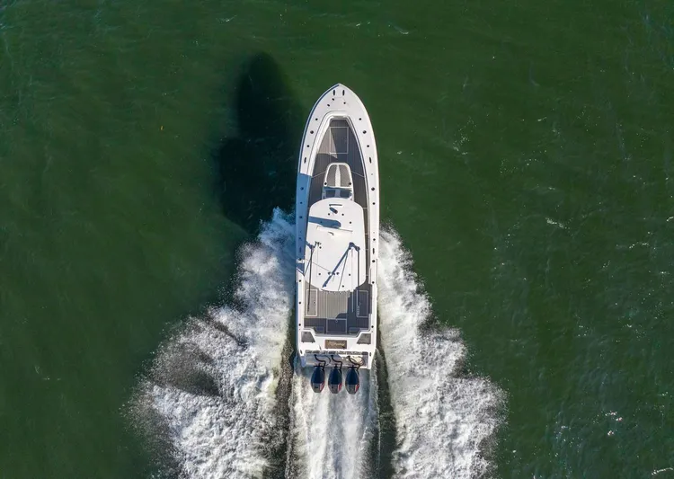 Catch 22 Yacht Photos Pics 2021 Front Runner 36 Center Console boat cruising on open water, aerial view.