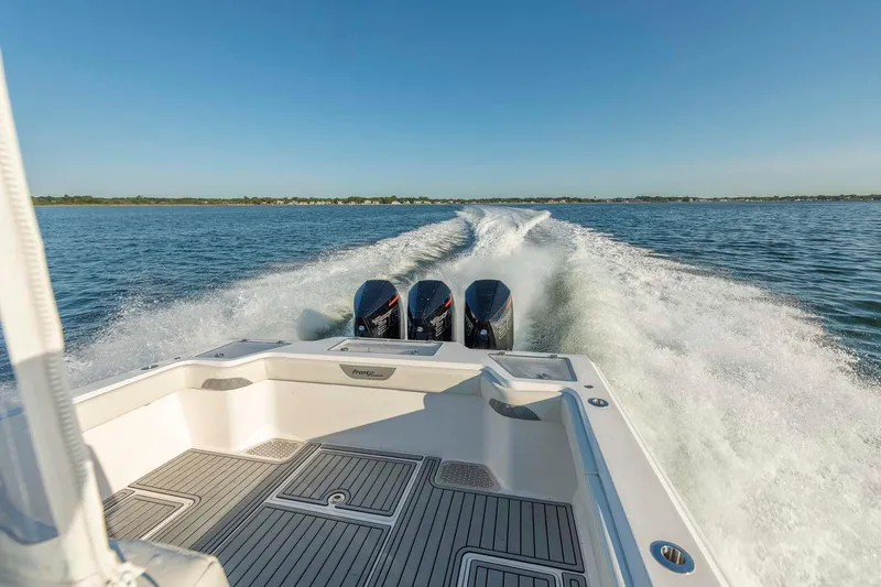 Catch 22 Yacht Photos Pics 2021 Front Runner 36 Center Console boat cruising on open water.
