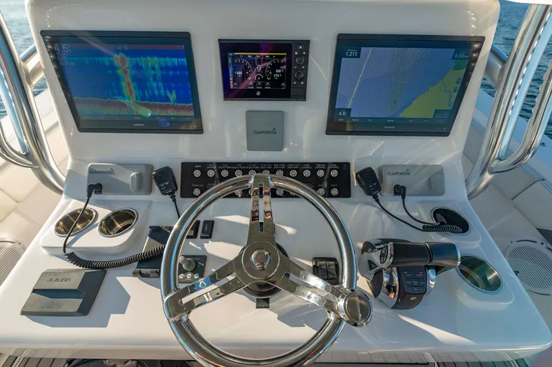 Catch 22 Yacht Photos Pics 2021 Front Runner 36 Center Console dashboard with advanced navigation displays and controls.
