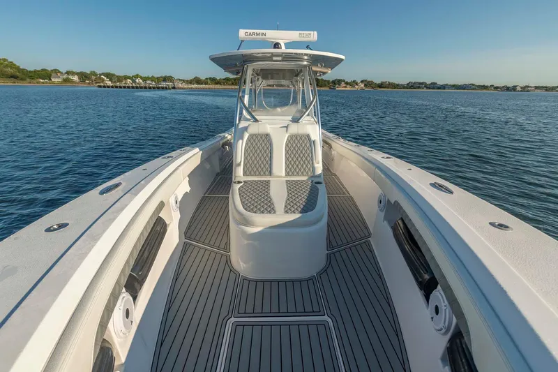 Catch 22 Yacht Photos Pics 2021 Front Runner 36 Center Console boat on calm water, showcasing sleek design and spacious deck.