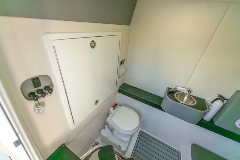 Catch 22 Yacht Photos Pics 2021 Front Runner 36 Center Console boat bathroom with toilet and sink.